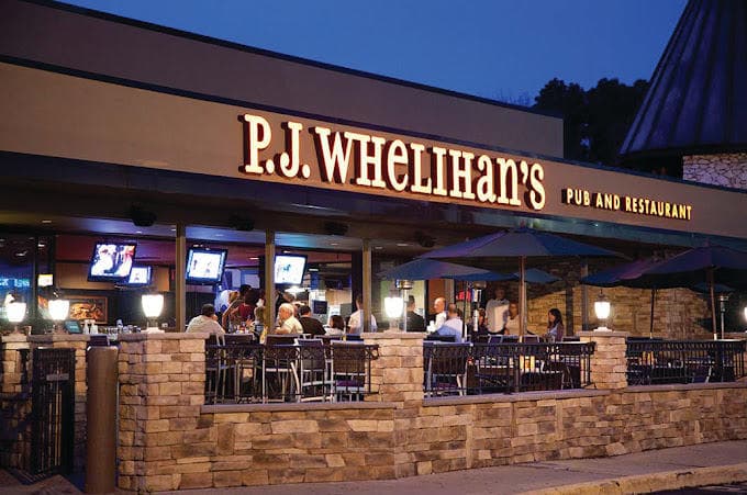 External Image of the Cherry Hill location with Stone Walls and outdoor seating